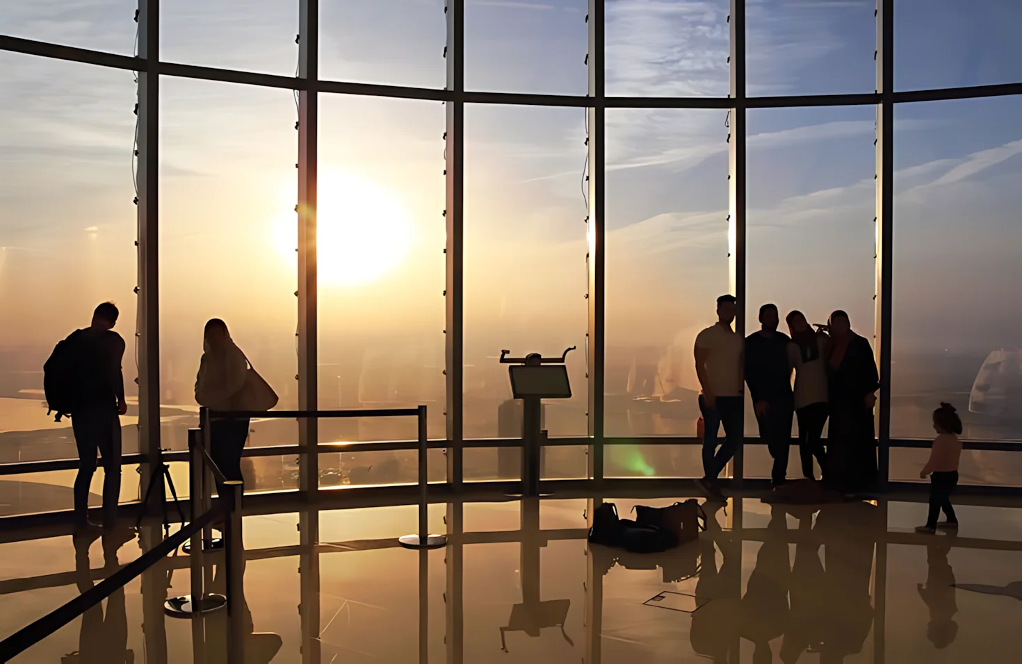 Sunset view from the Burj Khalifa observation deck overlooking the Dubai skyline