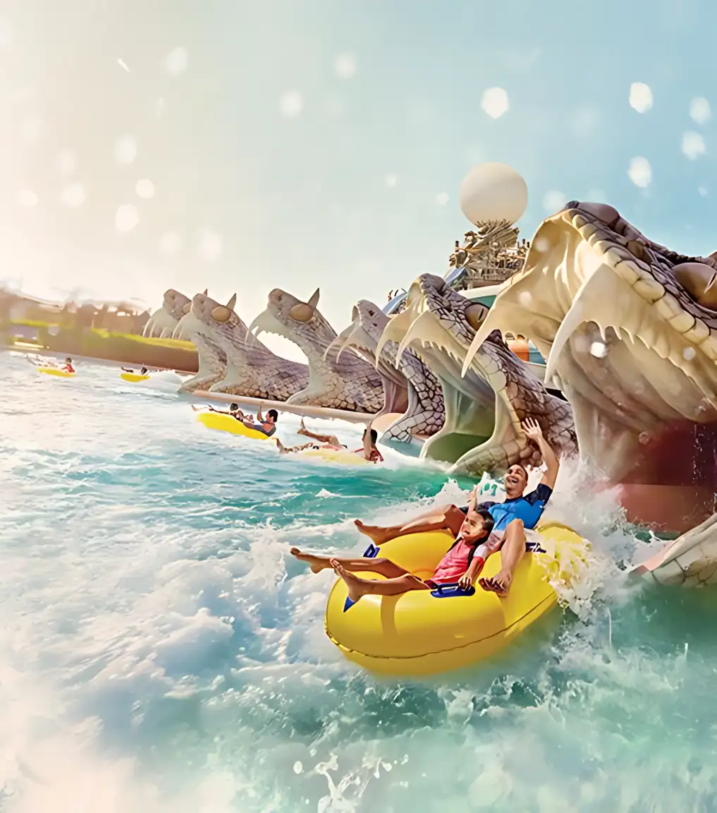 Family enjoying pools and water slides at Aquaventure Waterpark Dubai