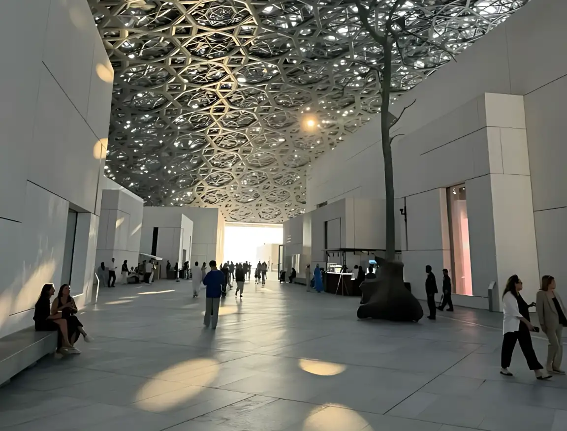 Sunlight filtering through the geometric dome inside Louvre Abu Dhabi