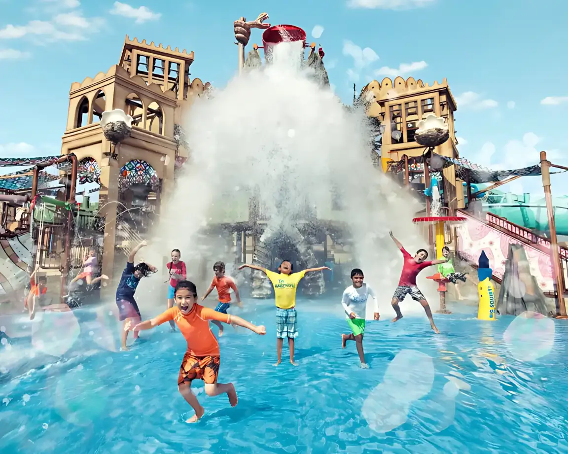 Children splashing in a family water attraction at Yas Waterworld Abu Dhabi